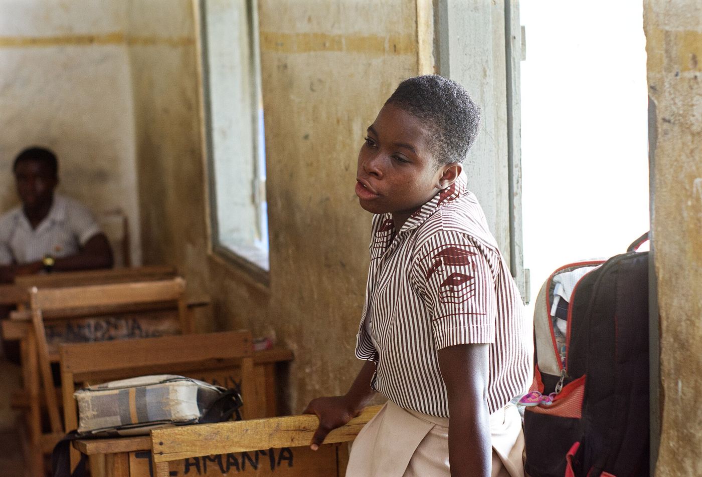 students asking questions during classroom lesson